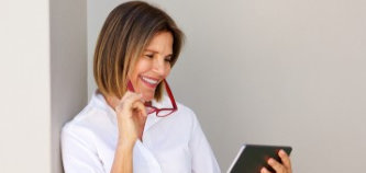 [Image of woman looking at a computer]  This page contains information about fees,and insurance